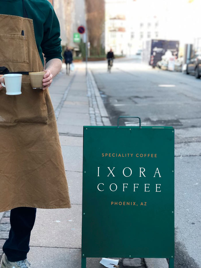Ixora-Coffee-branding-and-Logo-on-coffee-board-Wild-Bear-Designs